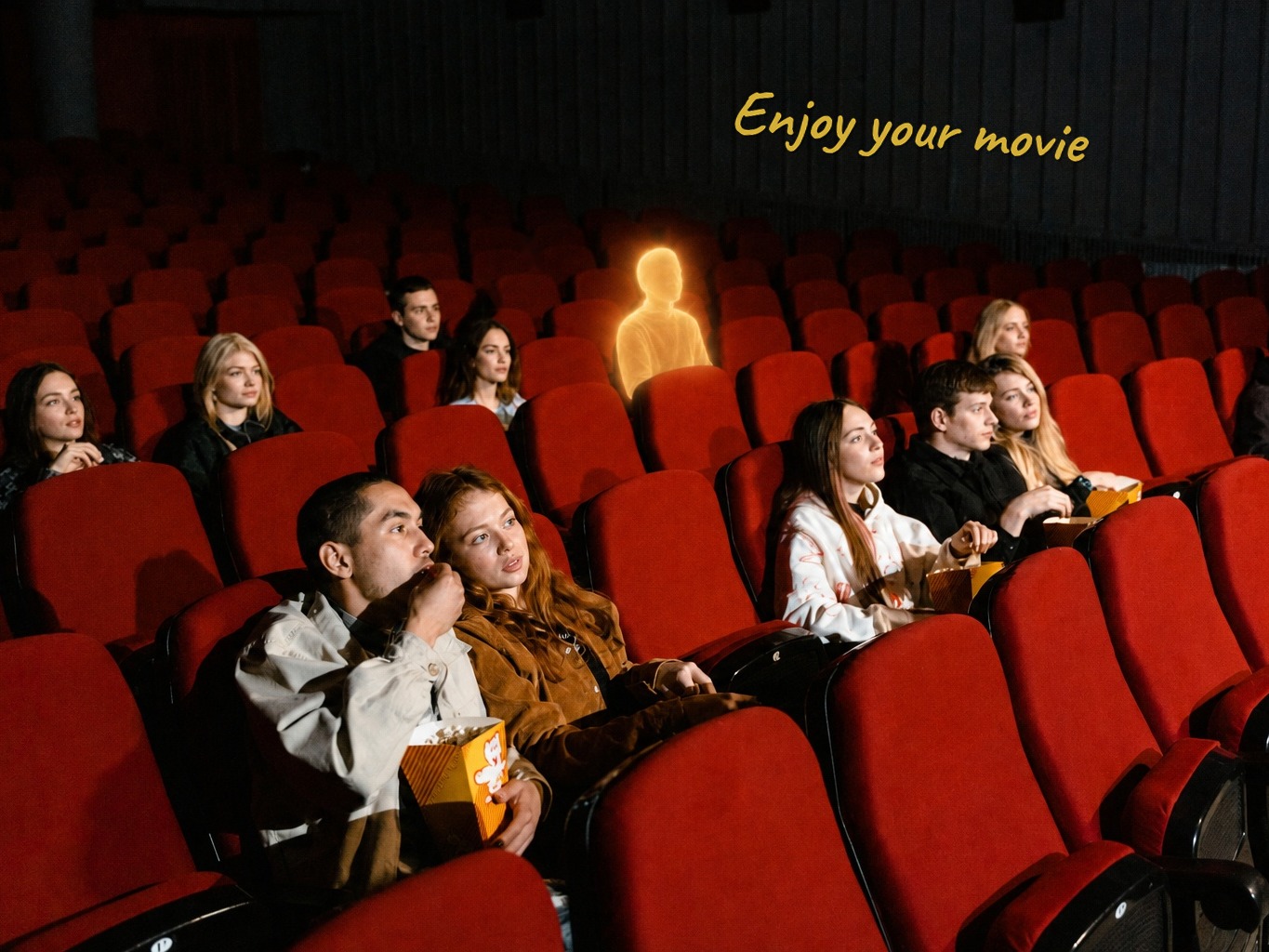 Cinema seats with a gold note saying enjoy your movie